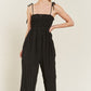 SMOCKED TIE STRAP JUMPSUIT